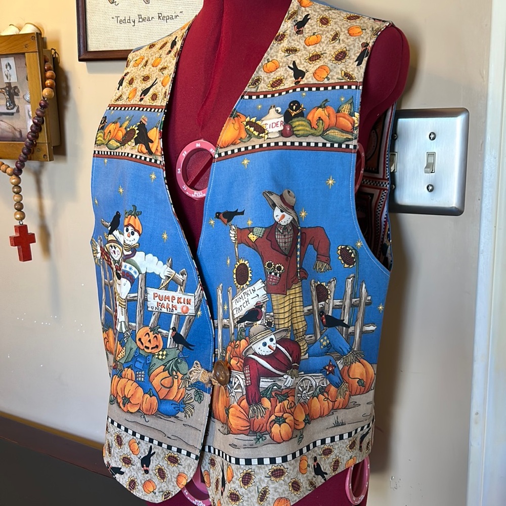 Hand crafted fall vest. Flannel inside, cotton fabric outside. Finished seems.